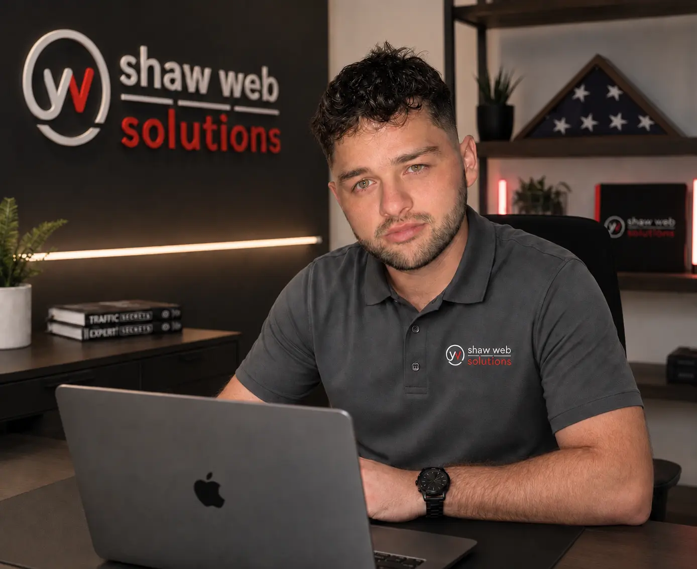 Hunter Shaw, founder and owner of Shaw Web Solutions, at his desk in the Shaw Web Solutions office